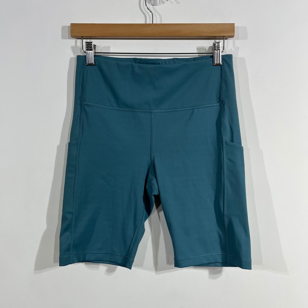 Athleta Sporty Ultimate Stash Pocket 7" Short 90s Biker Shorts Womens Medium Gym